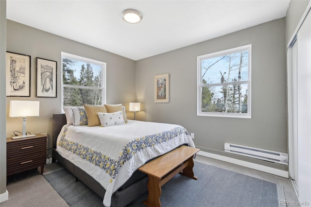11390 Shimley Rd, Golden, CO 80403 - bedroom featuring baseboard heating, multiple windows, and baseboards