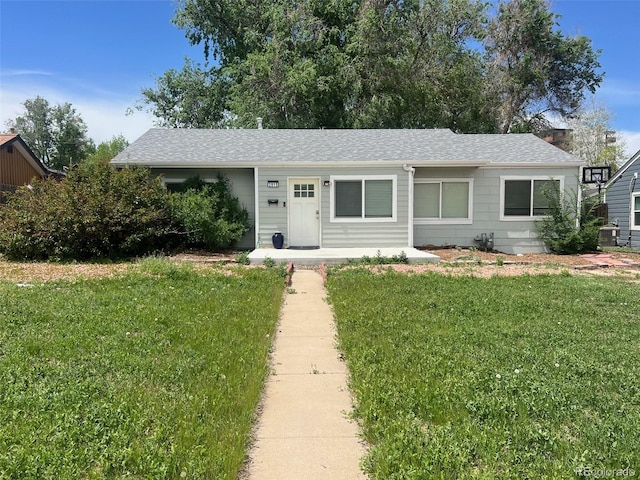 2815 S Dexter Way, Denver, CO 80222 - single story home with a front yard, a shingled roof, and central air condition unit