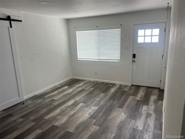 2815 S Dexter Way, Denver, CO 80222 - foyer with dark wood-style flooring, a barn door, and baseboards
