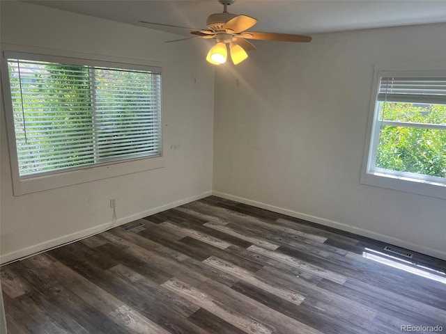 2815 S Dexter Way, Denver, CO 80222 - unfurnished room with ceiling fan, dark wood-style floors, and baseboards