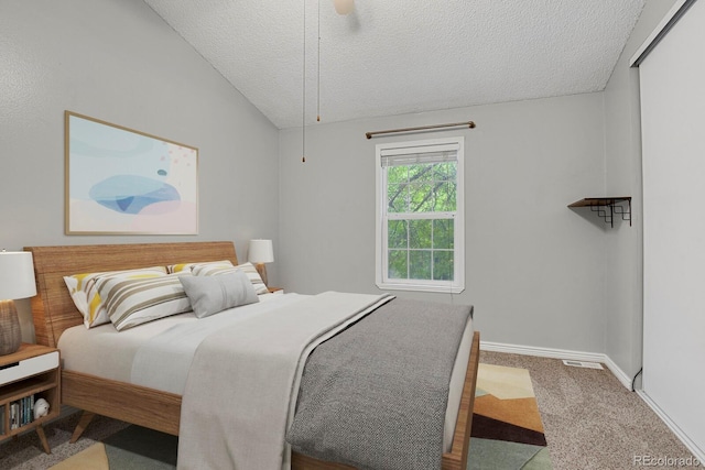 3619 Queen Anne Way, Colorado Springs, CO 80917 - bedroom with a textured ceiling, carpet flooring, baseboards, vaulted ceiling, and a ceiling fan