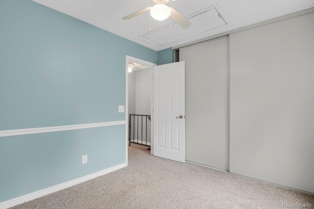 3619 Queen Anne Way, Colorado Springs, CO 80917 - unfurnished bedroom with attic access, carpet, a ceiling fan, and a closet