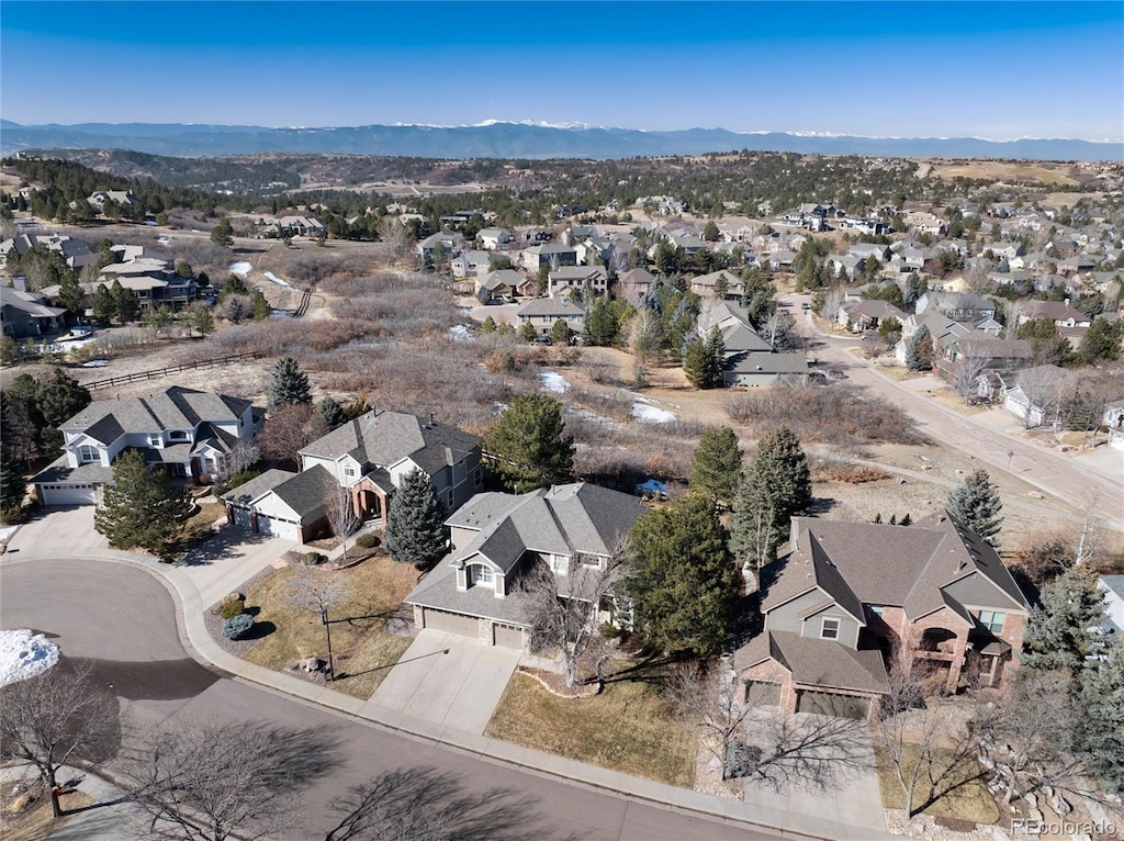 birds eye view of property with a mountain view