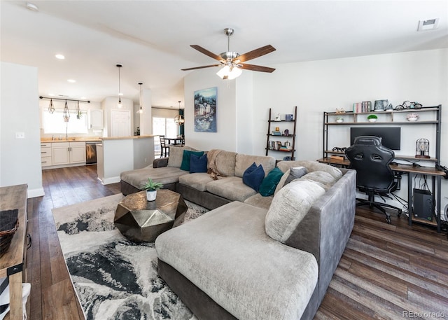 living room with dark hardwood / wood-style floors and ceiling fan