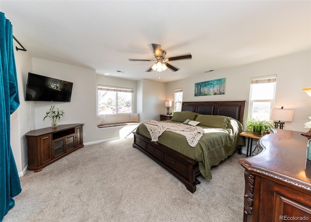 bedroom with light carpet and ceiling fan