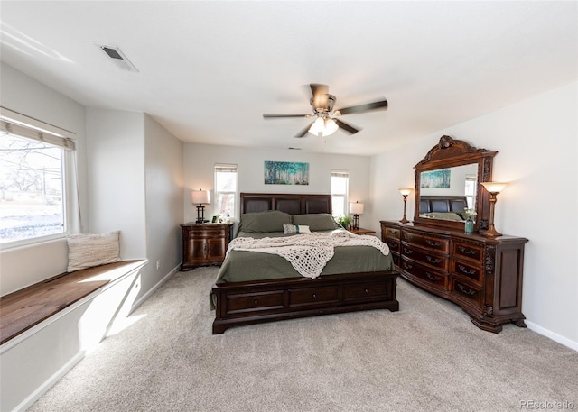 bedroom featuring light carpet and ceiling fan