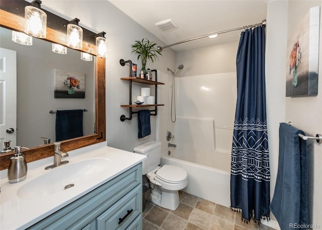 full bathroom featuring shower / tub combo, vanity, and toilet