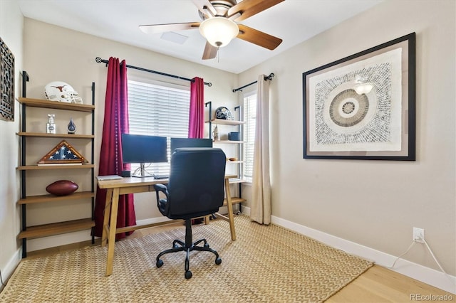 office with ceiling fan and light wood-type flooring