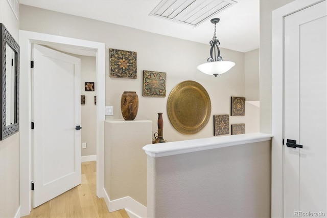 hallway with light wood-type flooring