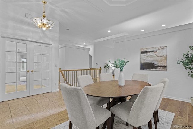 15876 Double Eagle Dr, Morrison, CO 80465 - dining space with french doors, recessed lighting, arched walkways, a chandelier, and light wood-type flooring