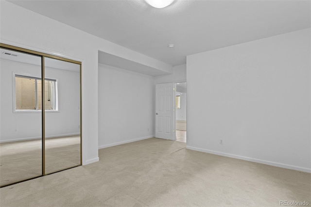 15876 Double Eagle Dr, Morrison, CO 80465 - unfurnished bedroom with carpet floors, a closet, and multiple windows