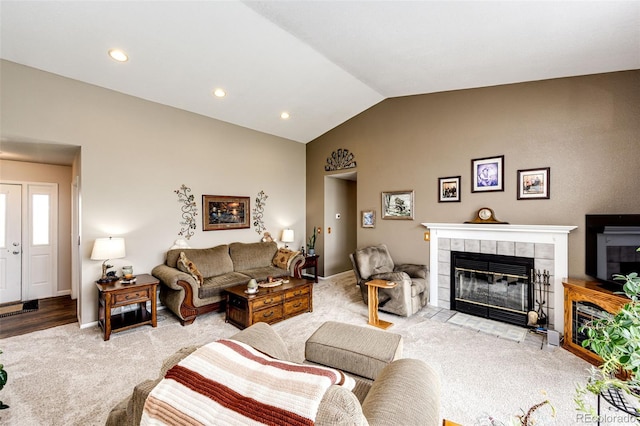 41020 US Highway 36, Bennett, CO 80102 - living area featuring a fireplace, vaulted ceiling, light colored carpet, and recessed lighting