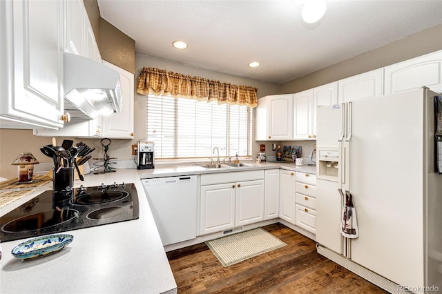 41020 US Highway 36, Bennett, CO 80102 - kitchen with white appliances, light countertops, white cabinetry, dark wood-type flooring, and recessed lighting