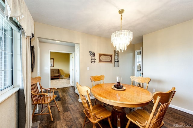 41020 US Highway 36, Bennett, CO 80102 - dining area with a chandelier and dark wood-style floors