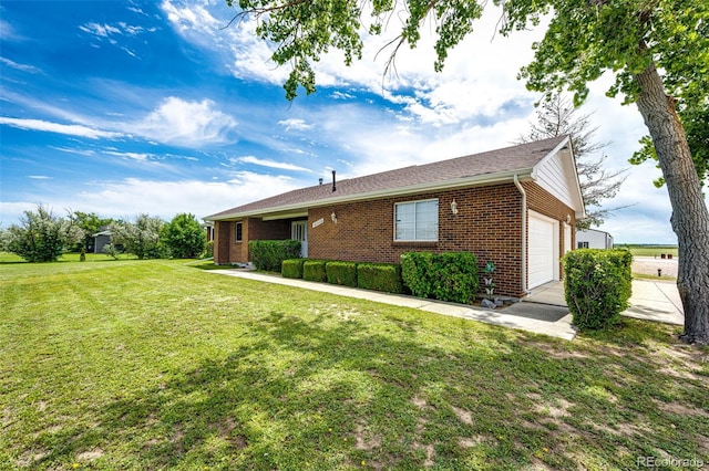 41020 US Highway 36, Bennett, CO 80102 - view of front of house with brick siding, a front yard, and an attached garage