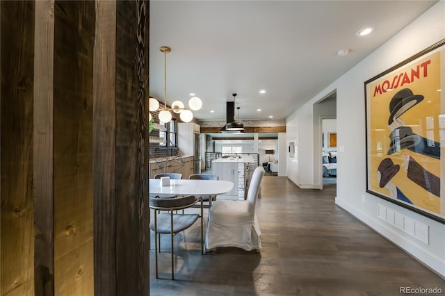 dining space with dark wood-type flooring