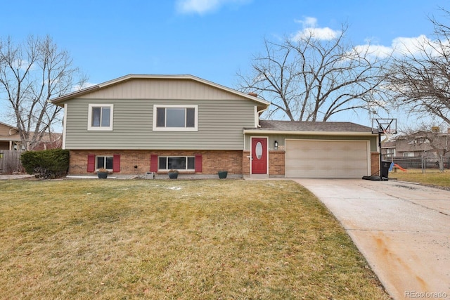 split level home with a garage and a front lawn