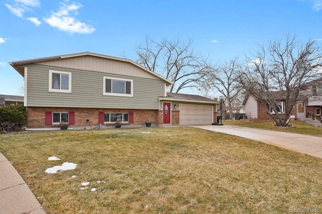 tri-level home featuring a front yard and a garage