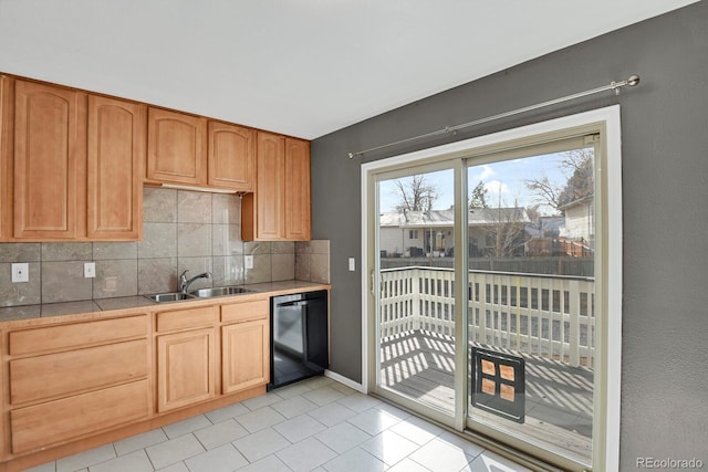 kitchen featuring dishwasher, decorative backsplash, sink, and light tile patterned floors