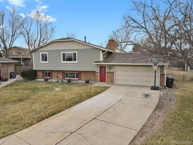 split level home featuring a front yard and a garage