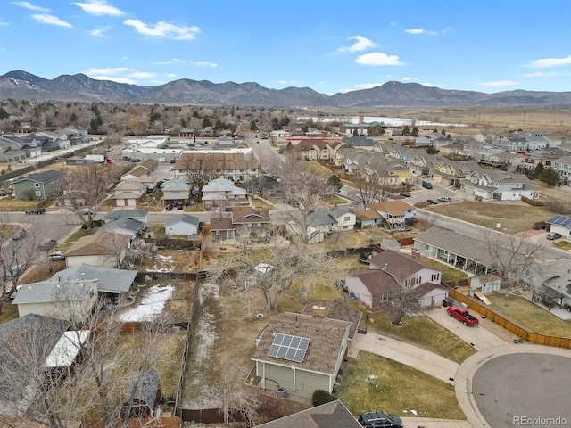 birds eye view of property with a mountain view