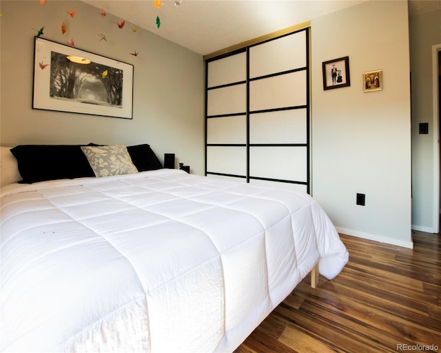 4110 Hale Pkwy Unit 5G, Denver, CO 80220 - bedroom featuring wood finished floors and baseboards