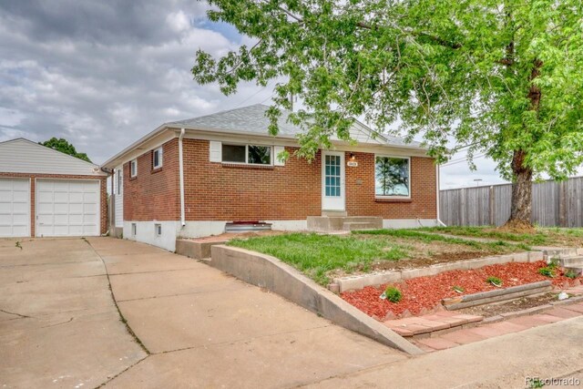 10420 Marion St, Northglenn, CO 80233 - bungalow-style house with brick siding, an outdoor structure, a garage, entry steps, and roof with shingles