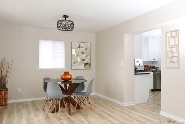 10420 Marion St, Northglenn, CO 80233 - dining space with light wood-type flooring and baseboards
