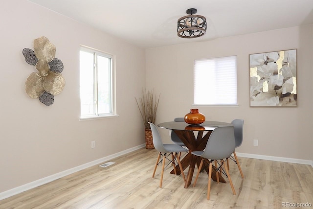 10420 Marion St, Northglenn, CO 80233 - dining area featuring light wood-style floors and baseboards