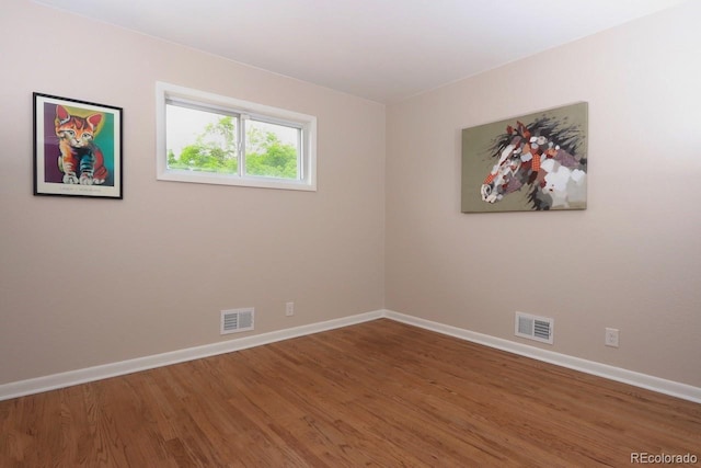 10420 Marion St, Northglenn, CO 80233 - spare room featuring wood finished floors and baseboards