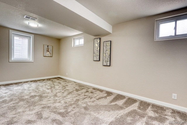 10420 Marion St, Northglenn, CO 80233 - below grade area with carpet, baseboards, and a textured ceiling