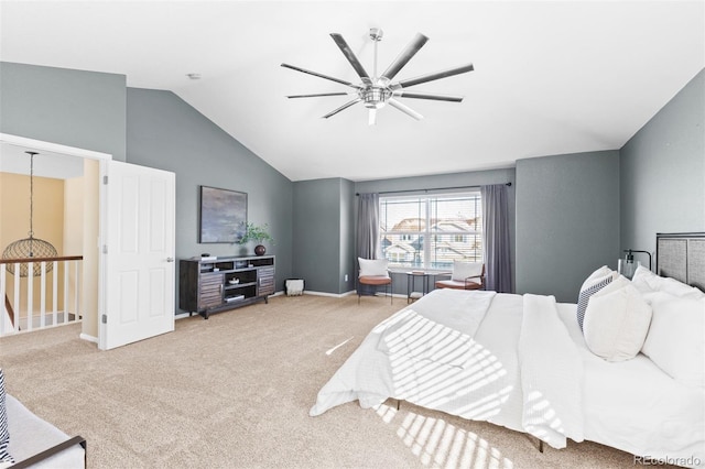 bedroom with vaulted ceiling, ceiling fan, and carpet flooring