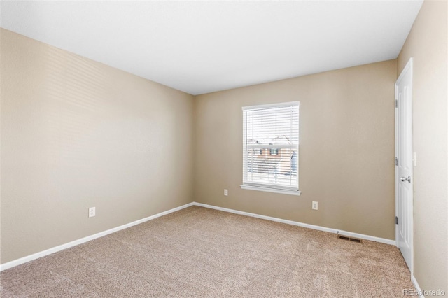 unfurnished room with light colored carpet