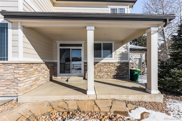 doorway to property with covered porch