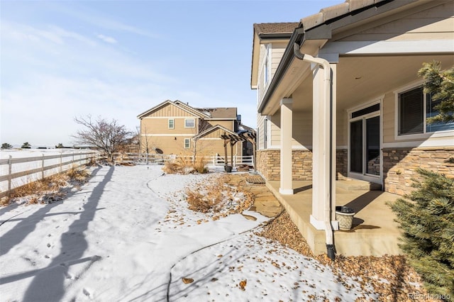 view of snow covered property