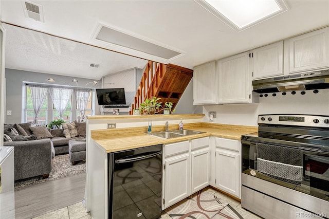 kitchen with open floor plan, light countertops, dishwasher, and stainless steel electric stove