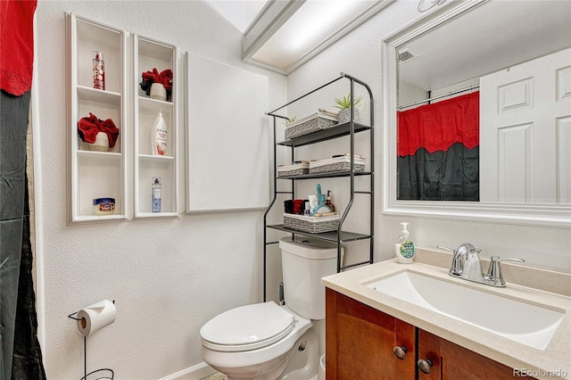 full bath with vanity and toilet