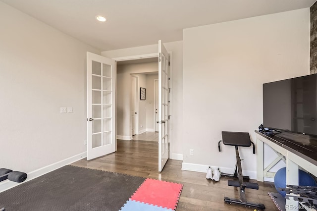 workout area with french doors, recessed lighting, baseboards, and wood finished floors
