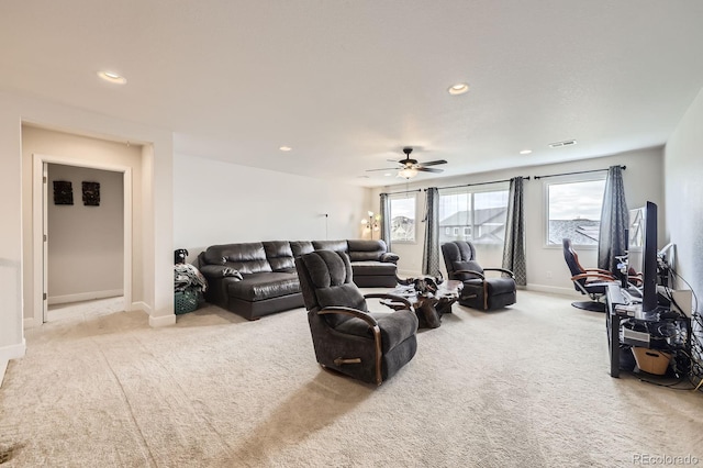 carpeted living area with baseboards, recessed lighting, ceiling fan, and visible vents