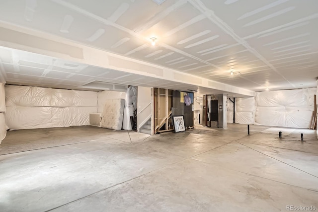 unfinished below grade area featuring stairs