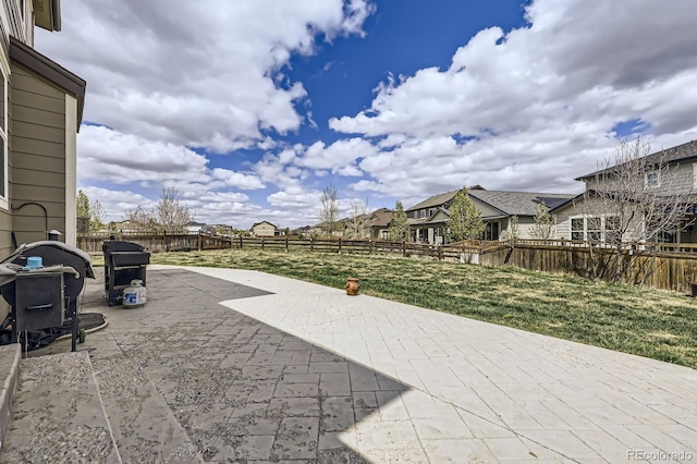 view of patio featuring a fenced backyard and area for grilling