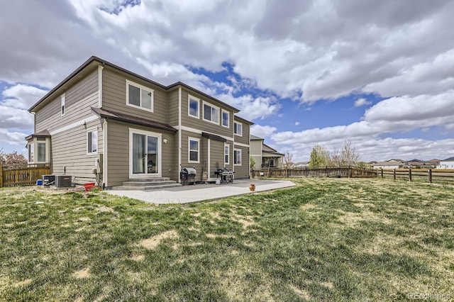 back of property featuring cooling unit, a fenced backyard, a patio area, entry steps, and a lawn