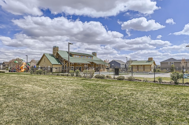 view of yard featuring fence and a residential view
