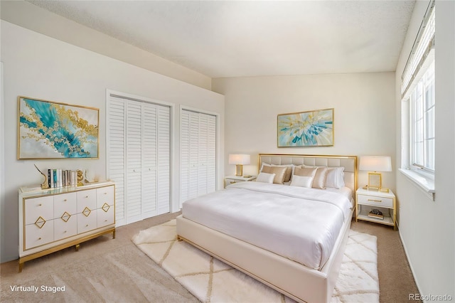 bedroom with light colored carpet