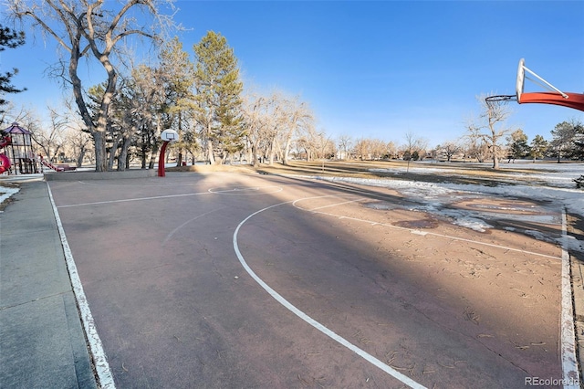 view of sport court featuring a playground