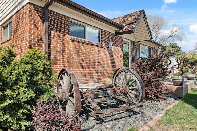 view of side of property with brick siding