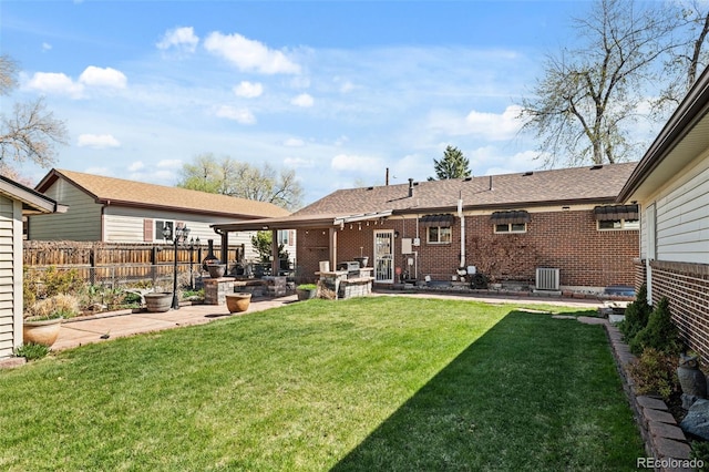 view of yard featuring a patio, central air condition unit, and fence
