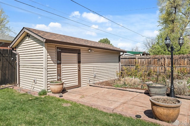 view of outbuilding featuring an outbuilding and a fenced backyard
