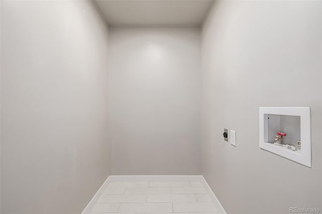 laundry area with baseboards, hookup for an electric dryer, hookup for a washing machine, and laundry area