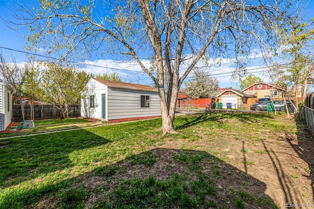 view of yard with an outbuilding and a fenced backyard